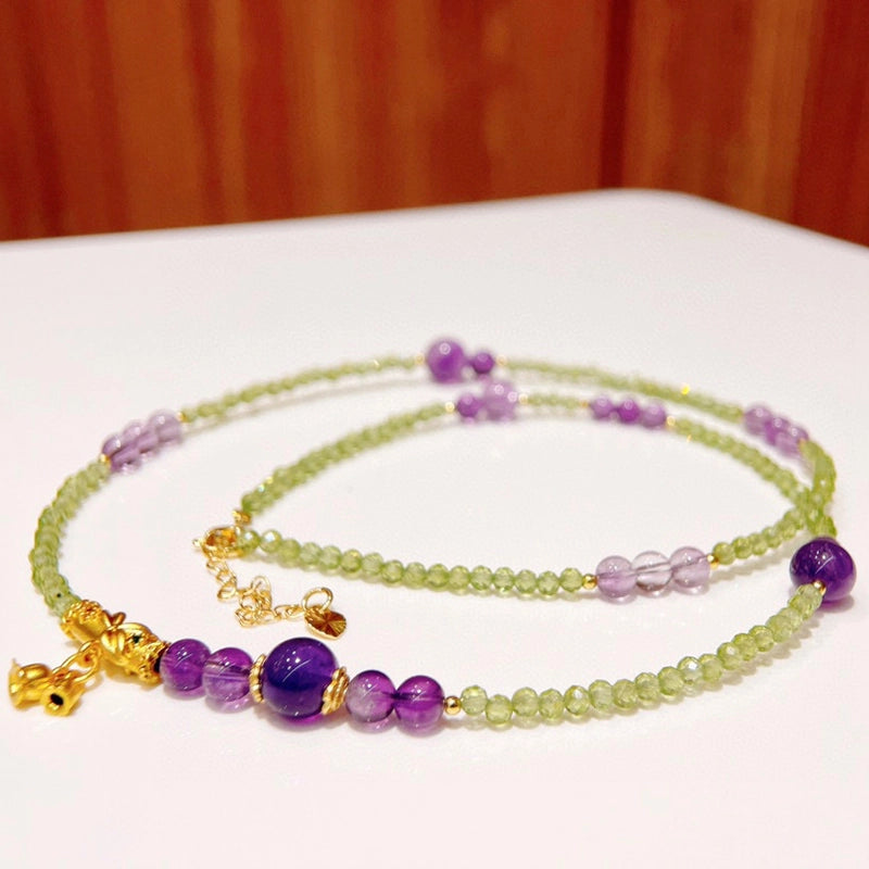 Adjustable Peridot and Amethyst bracelet convertible to a necklace with gold accents by Roline Crystal