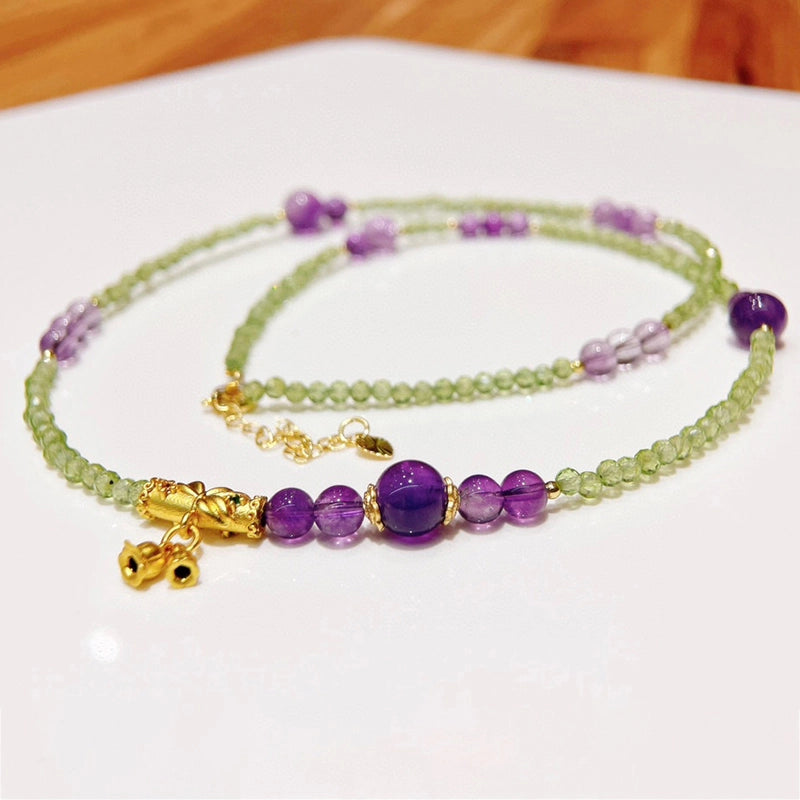Adjustable Peridot and Amethyst bracelet convertible to a necklace with gold accents by Roline Crystal
