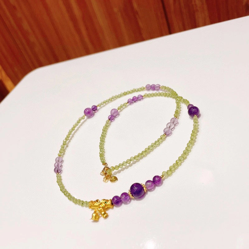 Adjustable Peridot and Amethyst bracelet convertible to a necklace with gold accents by Roline Crystal