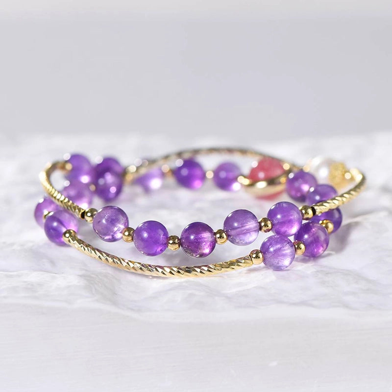 Amethyst double ring bracelet with strawberry quartz, pearls, and gold accents by Roline Crystal