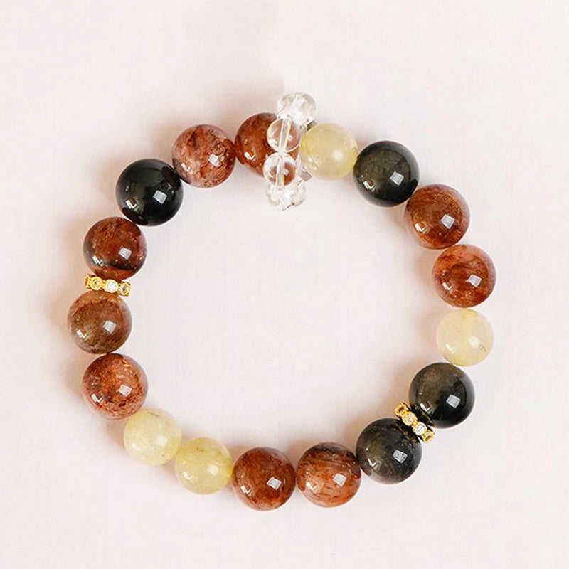 Black Gold Super 7 bracelet with obsidian, golden rutilated quartz, and gold accents by Roline Crystal