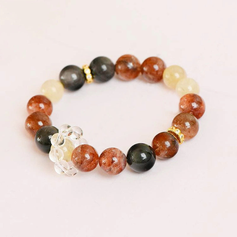 Black Gold Super 7 bracelet with obsidian, golden rutilated quartz, and gold accents by Roline Crystal