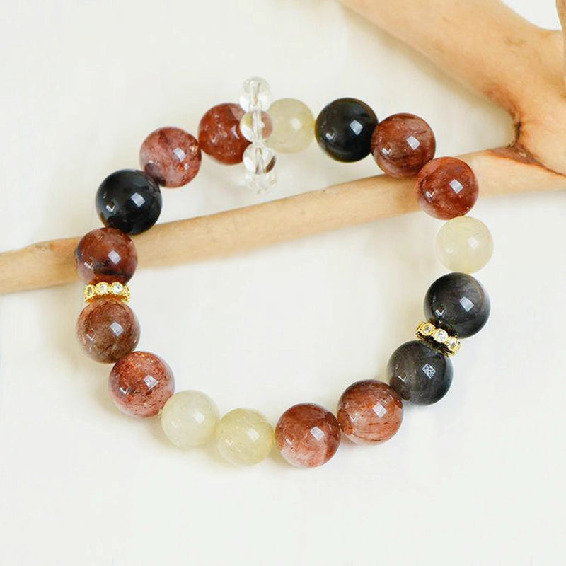 Black Gold Super 7 bracelet with obsidian, golden rutilated quartz, and gold accents by Roline Crystal