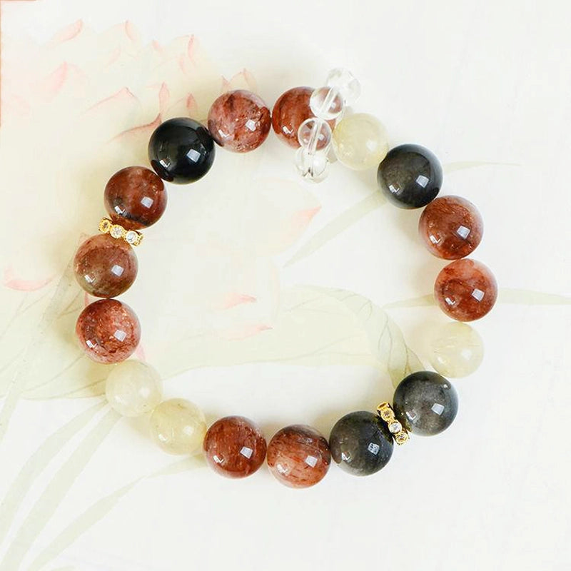 Black Gold Super 7 bracelet with obsidian, golden rutilated quartz, and gold accents by Roline Crystal