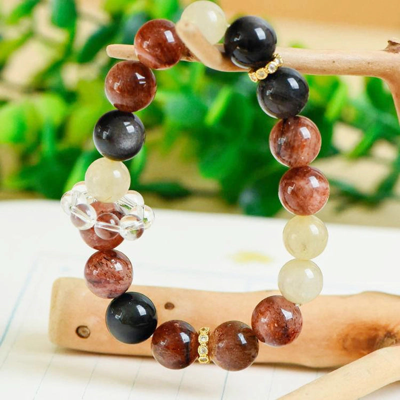 Black Gold Super 7 bracelet with obsidian, golden rutilated quartz, and gold accents by Roline Crystal