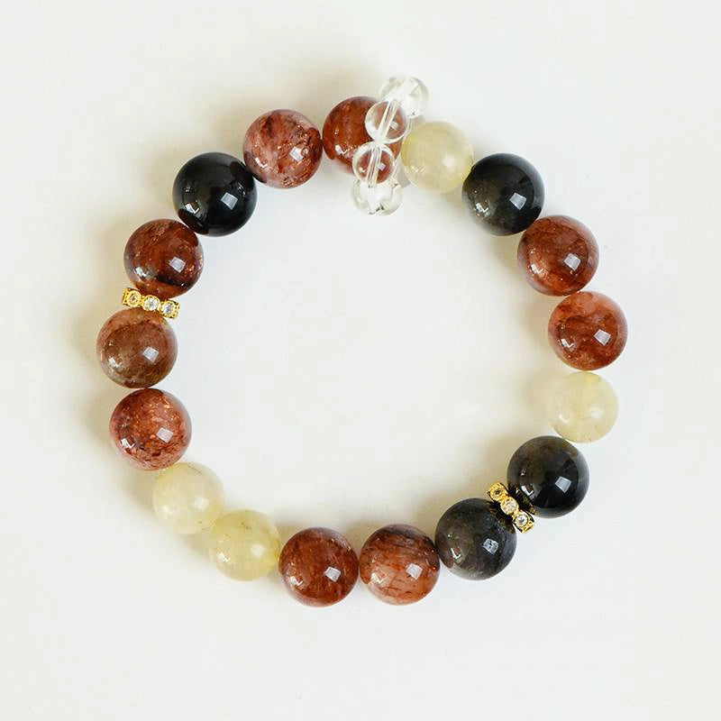 Black Gold Super 7 bracelet with obsidian, golden rutilated quartz, and gold accents by Roline Crystal