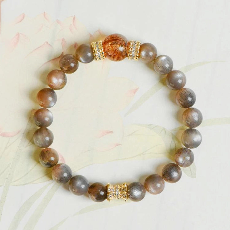 Black Sunstone bracelet with Black Gold Super 7 stones and gold accents – cosmic protection jewelry by Roline Crystal