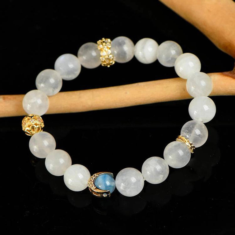 Blue Moonstone bracelet with aquamarine, clear quartz, and gold moon charms by Roline Crystal