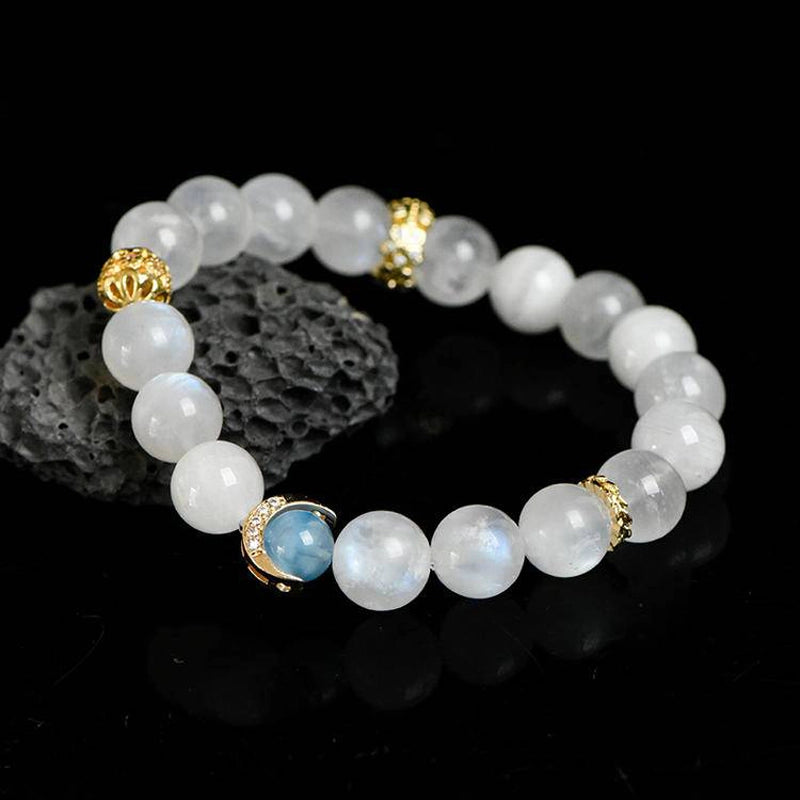 Blue Moonstone bracelet with aquamarine, clear quartz, and gold moon charms by Roline Crystal
