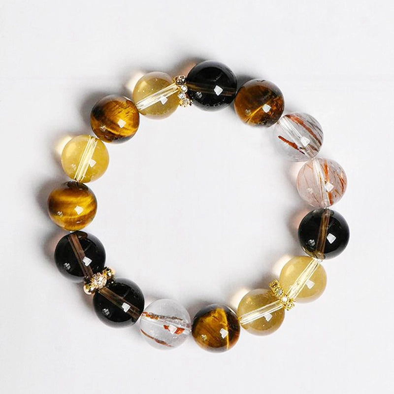 Citrine bracelet with smoky quartz, tiger’s eye, and gold charms by Roline Crystal