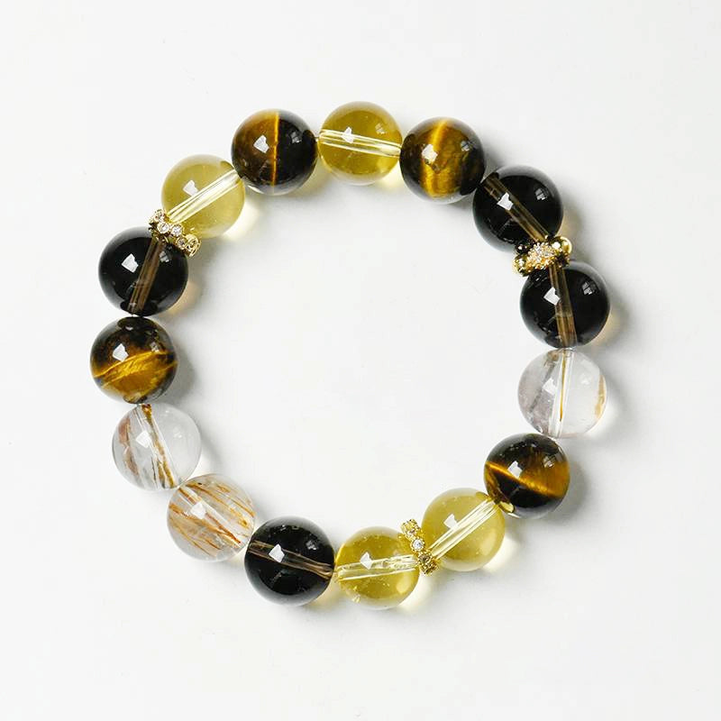 Citrine bracelet with smoky quartz, tiger’s eye, and gold charms by Roline Crystal