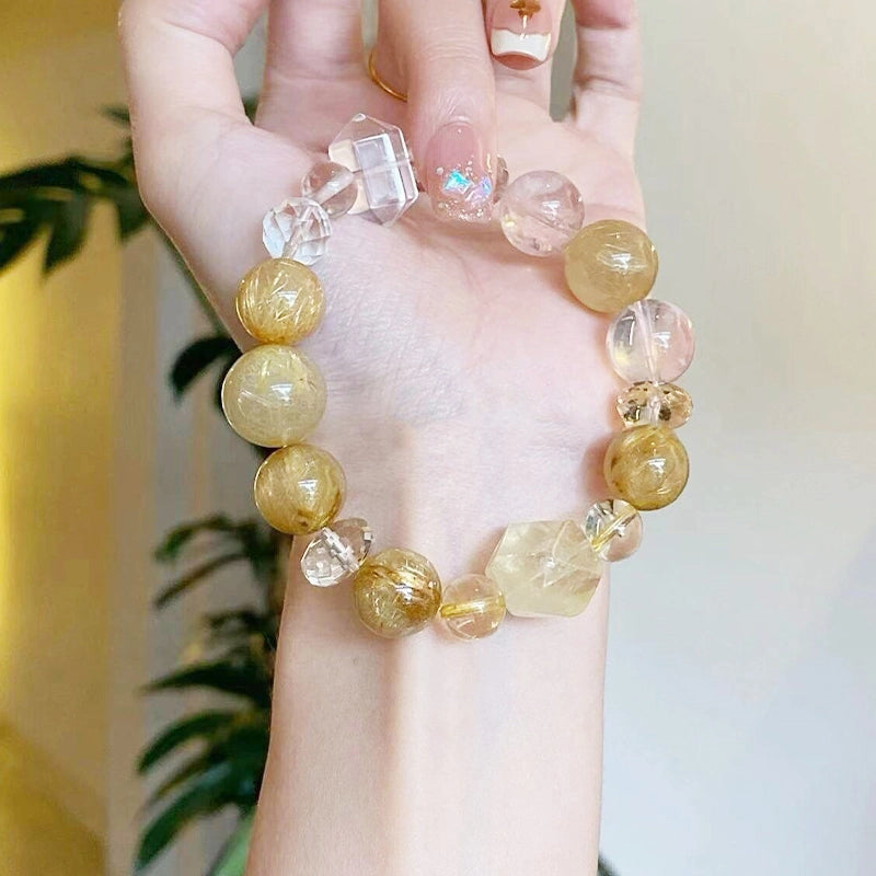 Golden rutilated quartz bracelet with citrine and double-terminated clear quartz beads by Roline Crystal