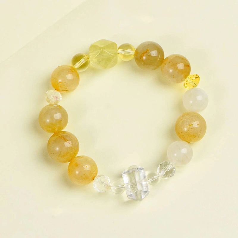 Golden rutilated quartz bracelet with citrine and double-terminated clear quartz beads by Roline Crystal