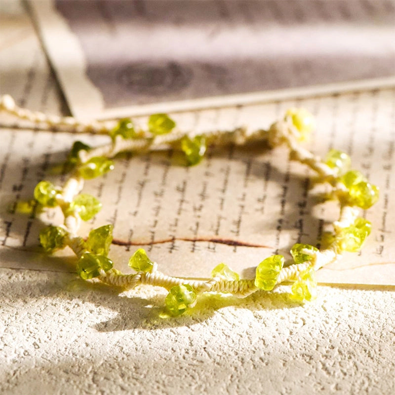 Hand-woven gravel crystal bracelet with peridot, strawberry quartz, citrine, aquamarine, and amethyst by Roline Crystal