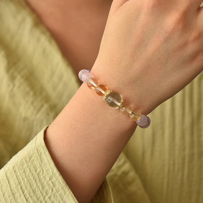 Monet Water Lily-inspired Rose Quartz bracelet with clear quartz, amethyst, grape agate, and gold accents by Roline Crystal