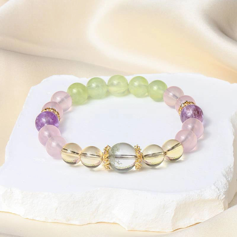 Monet Water Lily-inspired Rose Quartz bracelet with clear quartz, amethyst, grape agate, and gold accents by Roline Crystal