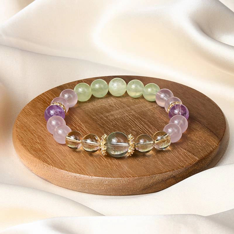 Monet Water Lily-inspired Rose Quartz bracelet with clear quartz, amethyst, grape agate, and gold accents by Roline Crystal