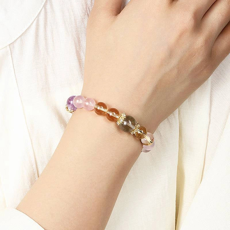 Monet Water Lily-inspired Rose Quartz bracelet with clear quartz, amethyst, grape agate, and gold accents by Roline Crystal