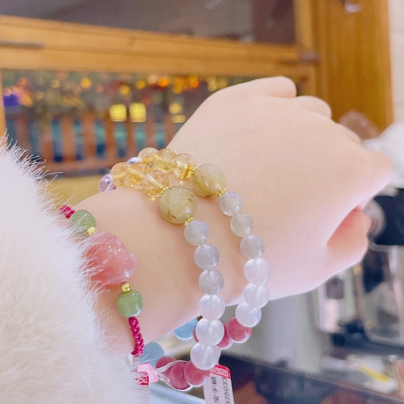 Multi-gemstone healing bracelet with moonstone, rose quartz, and amethyst beads by Roline Crystal