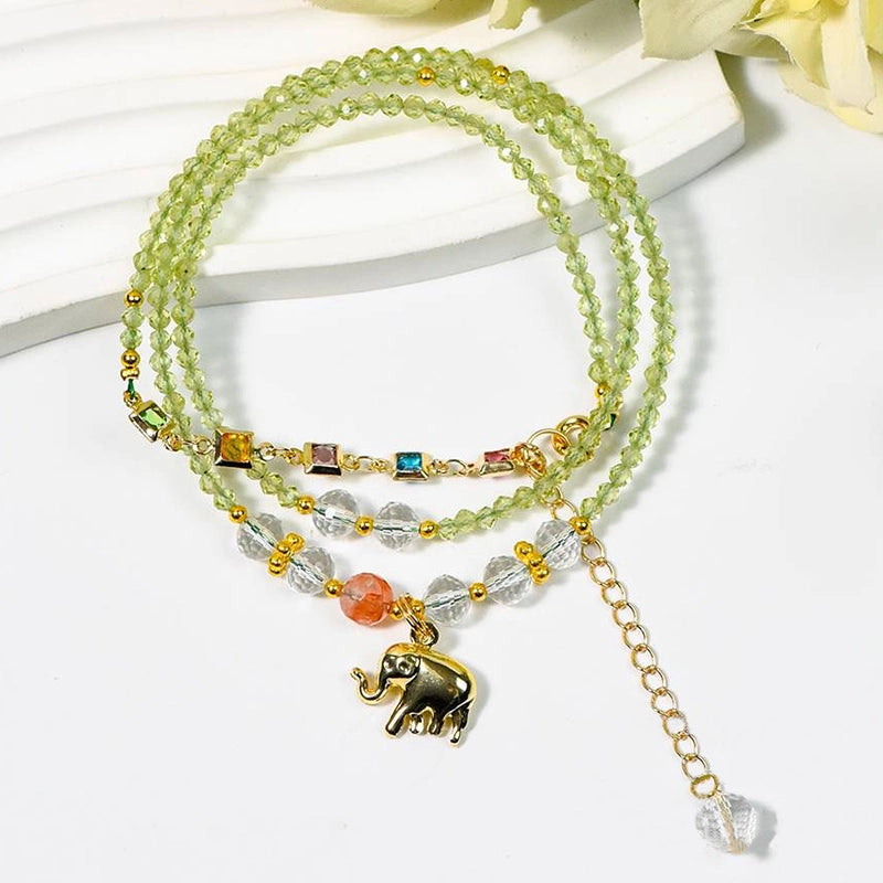 Peridot faceted bracelet with golden elephant charm, convertible to a necklace by Roline Crystal