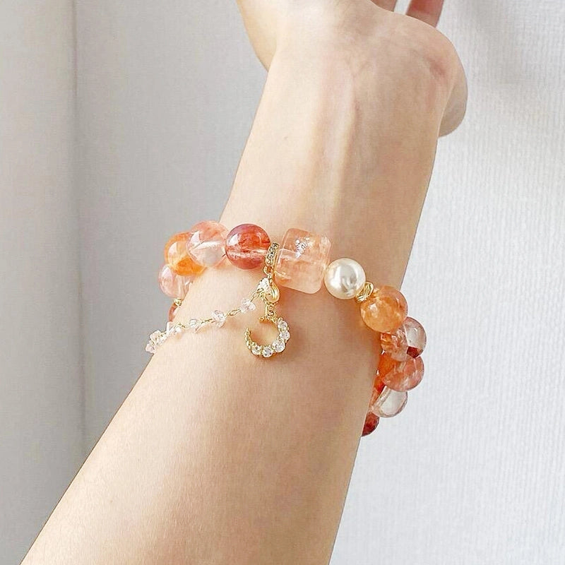 Red gum flower bracelet with golden moon charm, magic box bead, and pearls by Roline Crystal
