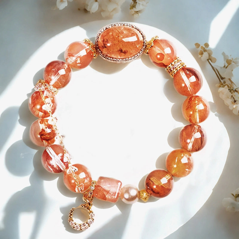 Red gum flower bracelet with golden moon charm, magic box bead, and pearls by Roline Crystal