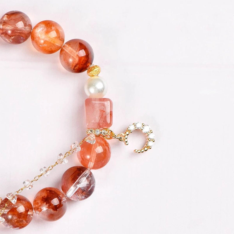 Red gum flower bracelet with golden moon charm, magic box bead, and pearls by Roline Crystal