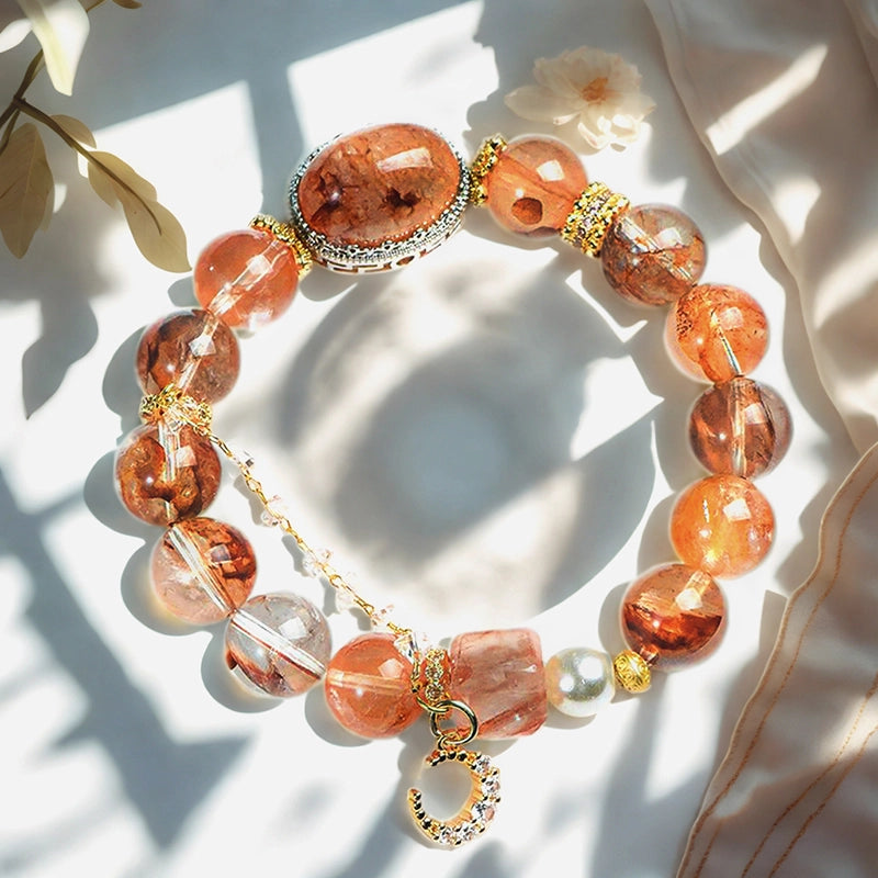 Red gum flower bracelet with golden moon charm, magic box bead, and pearls by Roline Crystal