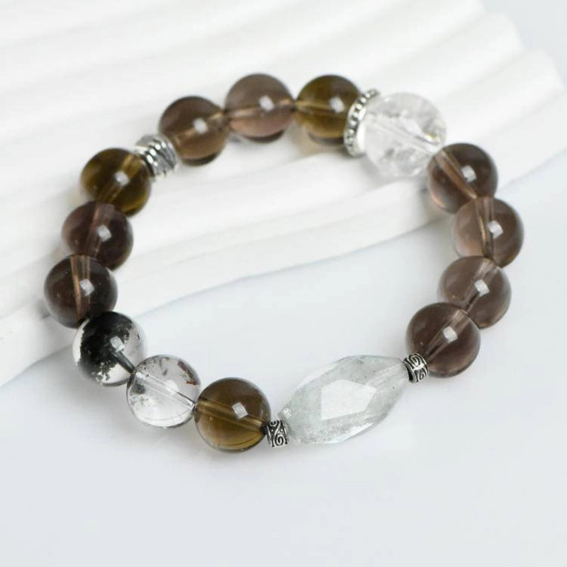 Smoky Quartz bracelet with Phantom Quartz, Clear Quartz, and silver charms – grounding crystal jewelry by Roline Crystal