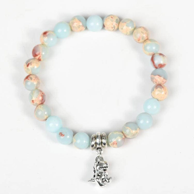 Snakeskin stone bracelet with Horus Eye, owl, lion, and symbolic charms by Roline Crystal