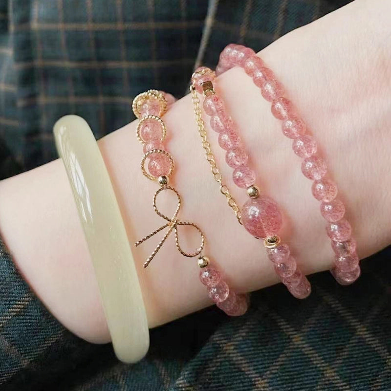 Strawberry crystal multi-ring bracelet with golden bow and chain accents by Roline Crystal