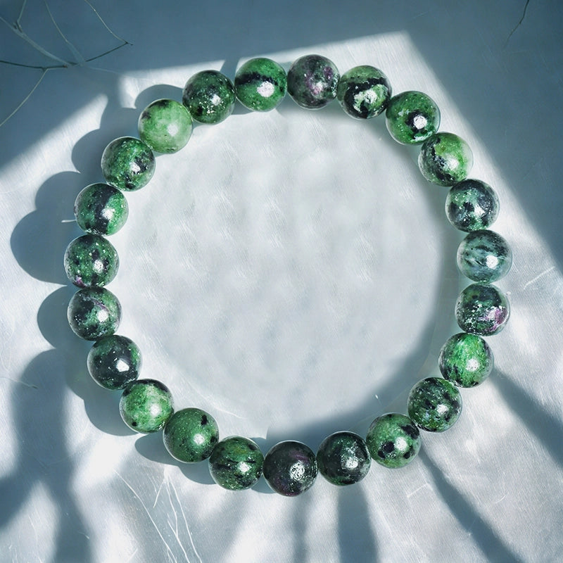 Zoisite bracelet with 8mm green polished beads by Roline Crystal