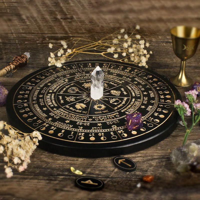 The ritual tools of the witch: wooden carved altar astrolabe, moon phase calendar prayer ritual wheel