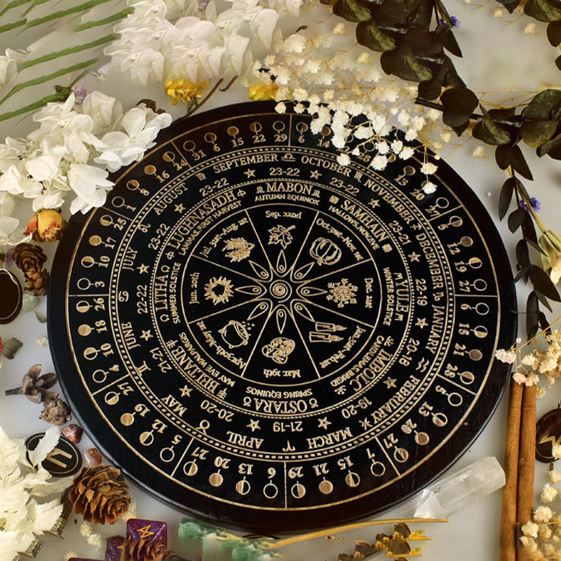 The ritual tools of the witch: wooden carved altar astrolabe, moon phase calendar prayer ritual wheel