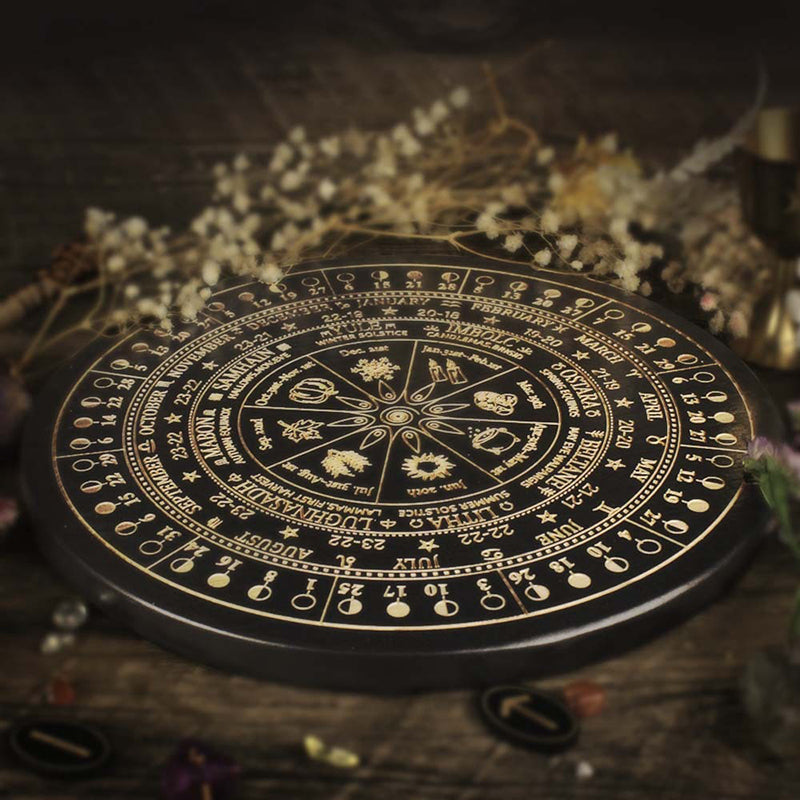 The ritual tools of the witch: wooden carved altar astrolabe, moon phase calendar prayer ritual wheel