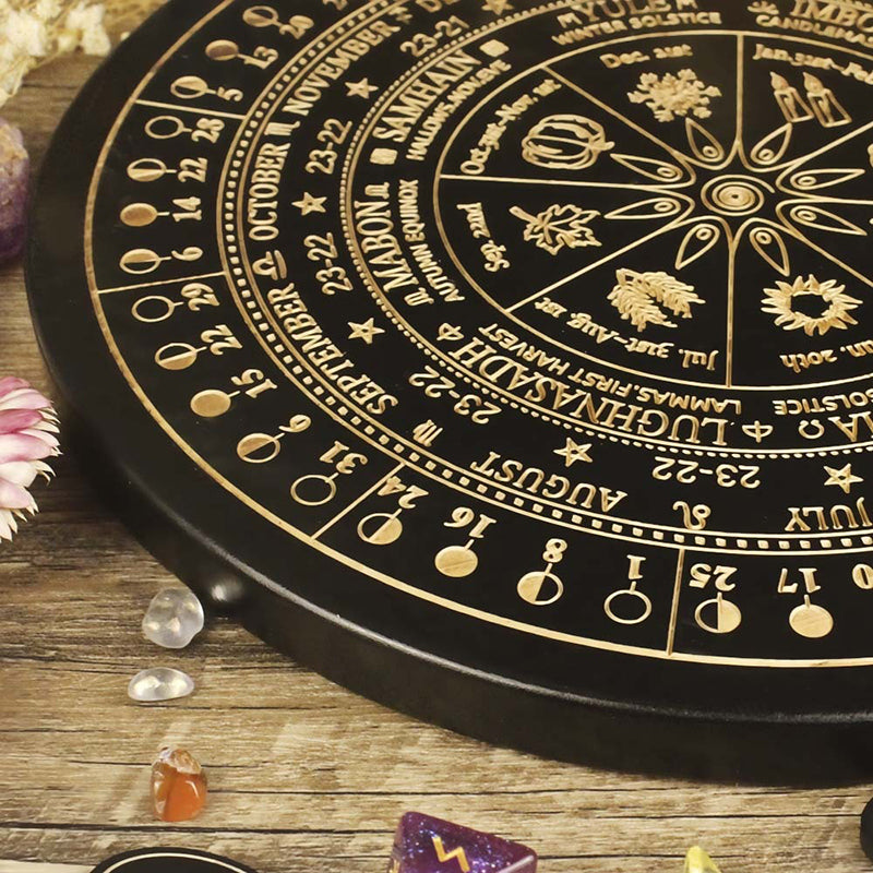 The ritual tools of the witch: wooden carved altar astrolabe, moon phase calendar prayer ritual wheel