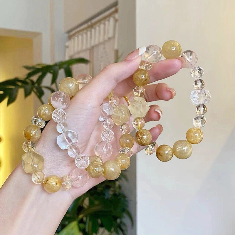 Golden rutilated quartz bracelet with citrine and double-terminated clear quartz beads by Roline Crystal