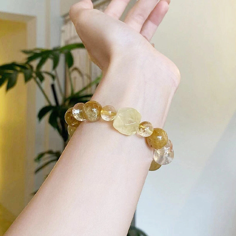 Golden rutilated quartz bracelet with citrine and double-terminated clear quartz beads by Roline Crystal