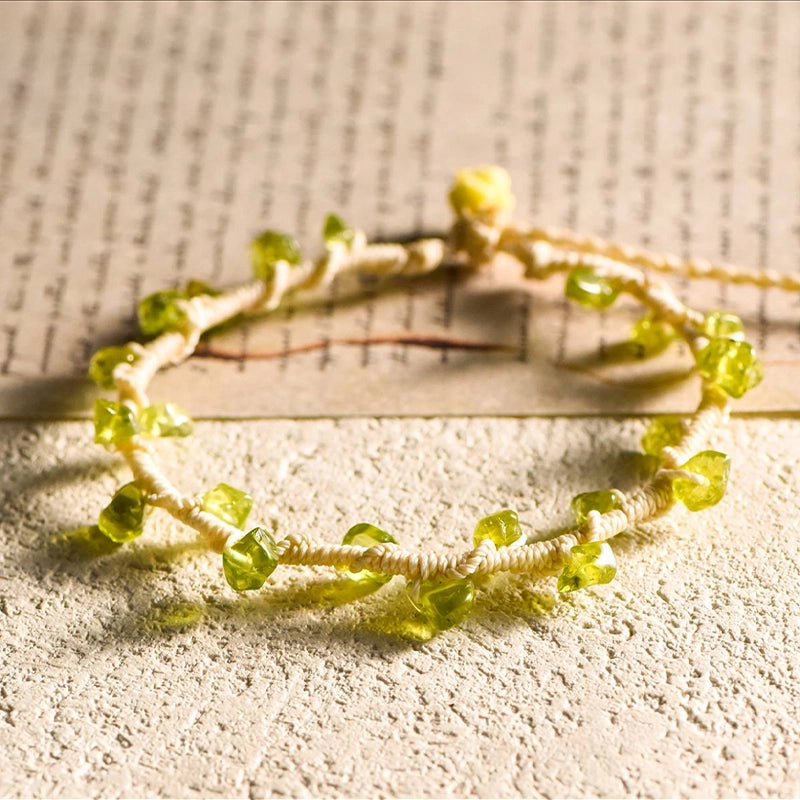 Hand-woven gravel crystal bracelet with peridot, strawberry quartz, citrine, aquamarine, and amethyst by Roline Crystal