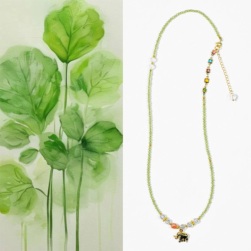 Peridot faceted bracelet with golden elephant charm, convertible to a necklace by Roline Crystal