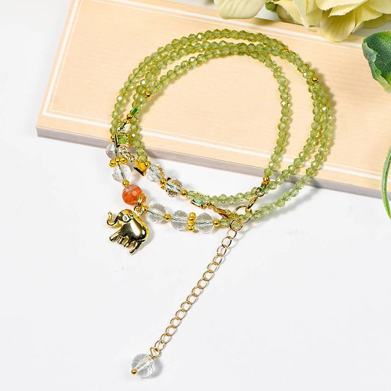 Peridot faceted bracelet with golden elephant charm, convertible to a necklace by Roline Crystal
