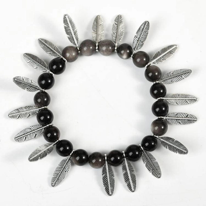 Silver Obsidian bracelet with Tree of Life, owl, lion, and yin-yang charms by Roline Crystal