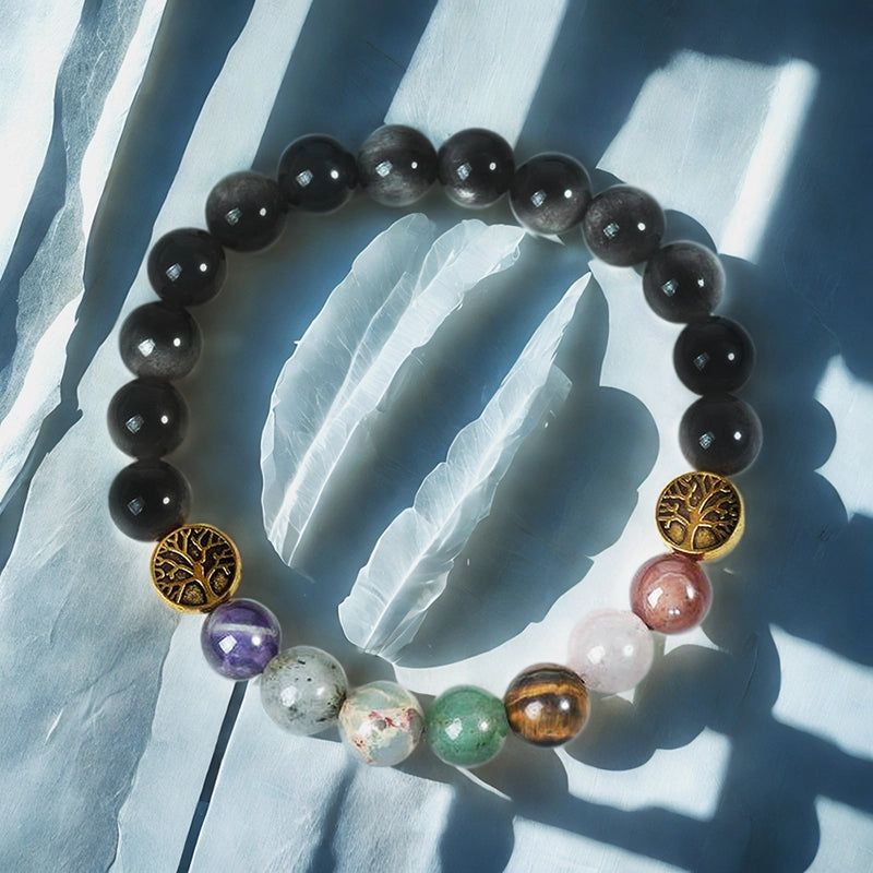 Silver Obsidian bracelet with Tree of Life, owl, lion, and yin-yang charms by Roline Crystal