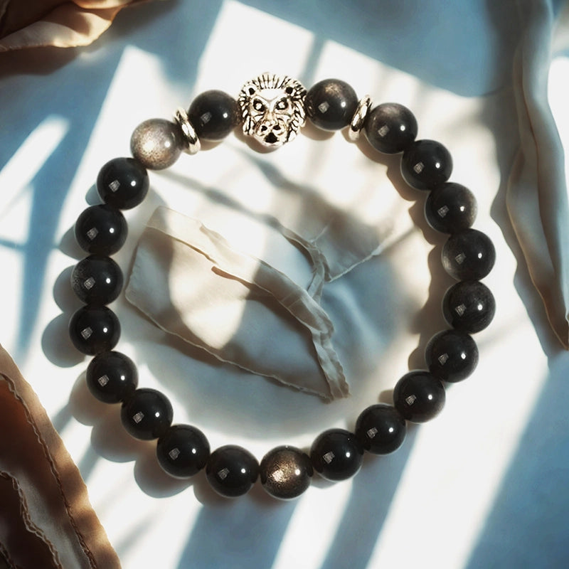 Silver Obsidian bracelet with Tree of Life, owl, lion, and yin-yang charms by Roline Crystal