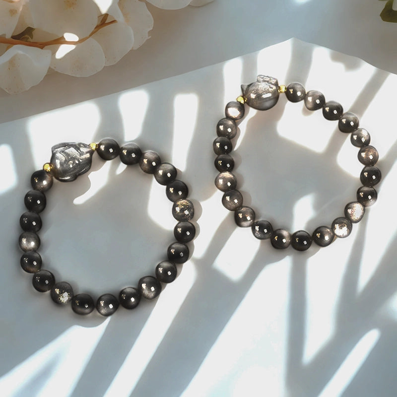 Silver Obsidian bracelet with floral, nine-tailed fox, and rabbit charms by Roline Crystal