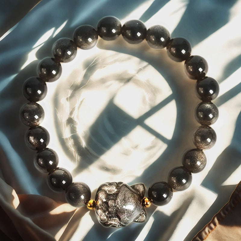 Silver Obsidian bracelet with floral, nine-tailed fox, and rabbit charms by Roline Crystal